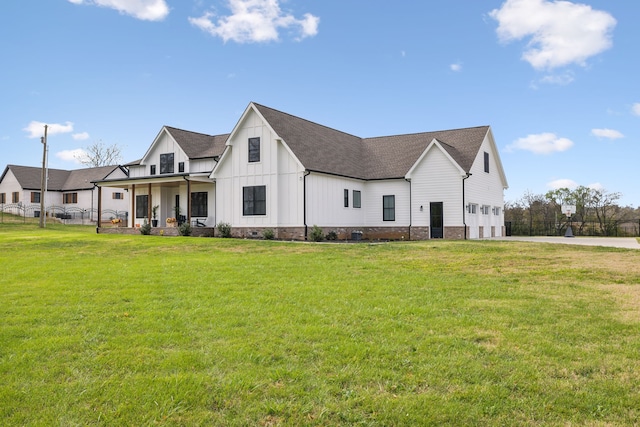 exterior space with a porch and a front yard