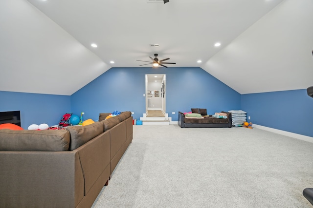 carpeted living room featuring vaulted ceiling and ceiling fan