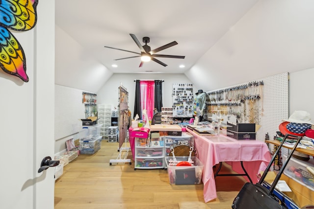 office area featuring light hardwood / wood-style flooring, lofted ceiling, and ceiling fan