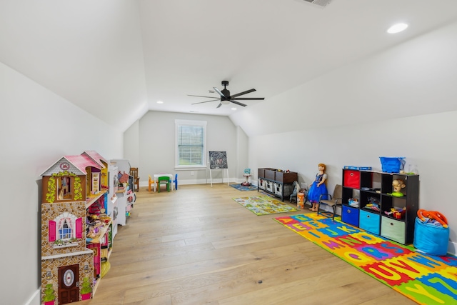 game room featuring hardwood / wood-style flooring, ceiling fan, and vaulted ceiling