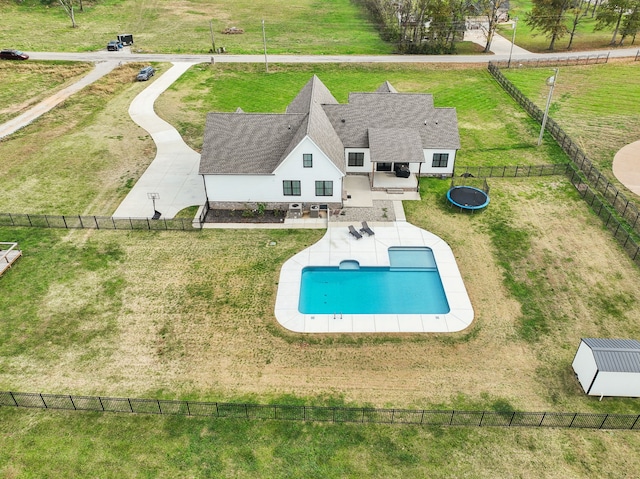 view of swimming pool with a lawn and a patio area