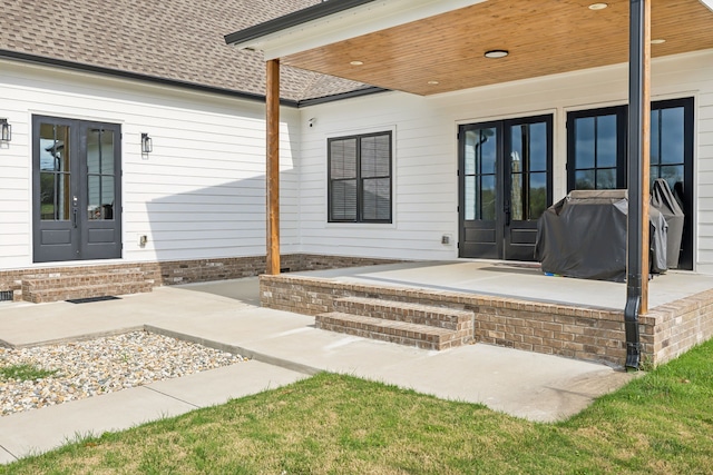 doorway to property featuring french doors and a patio area