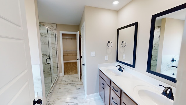 bathroom with an enclosed shower and vanity