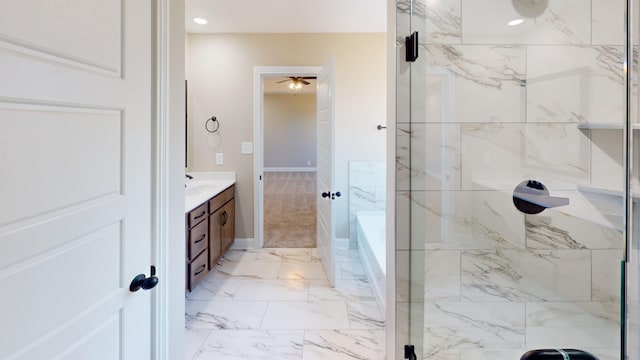 bathroom featuring vanity, ceiling fan, and independent shower and bath