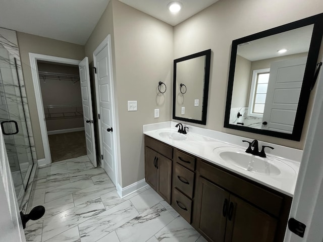 bathroom with vanity and a shower with shower door