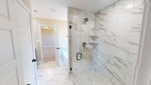 bathroom with a shower with shower door