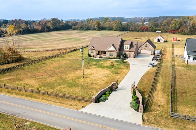 birds eye view of property with a rural view