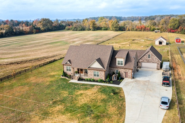 birds eye view of property featuring a rural view