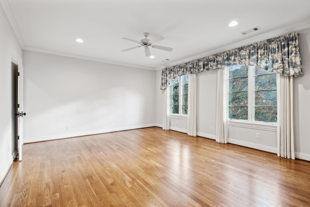 empty room with ceiling fan, light hardwood / wood-style flooring, and ornamental molding