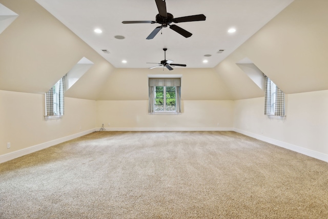 bonus room featuring lofted ceiling and carpet flooring