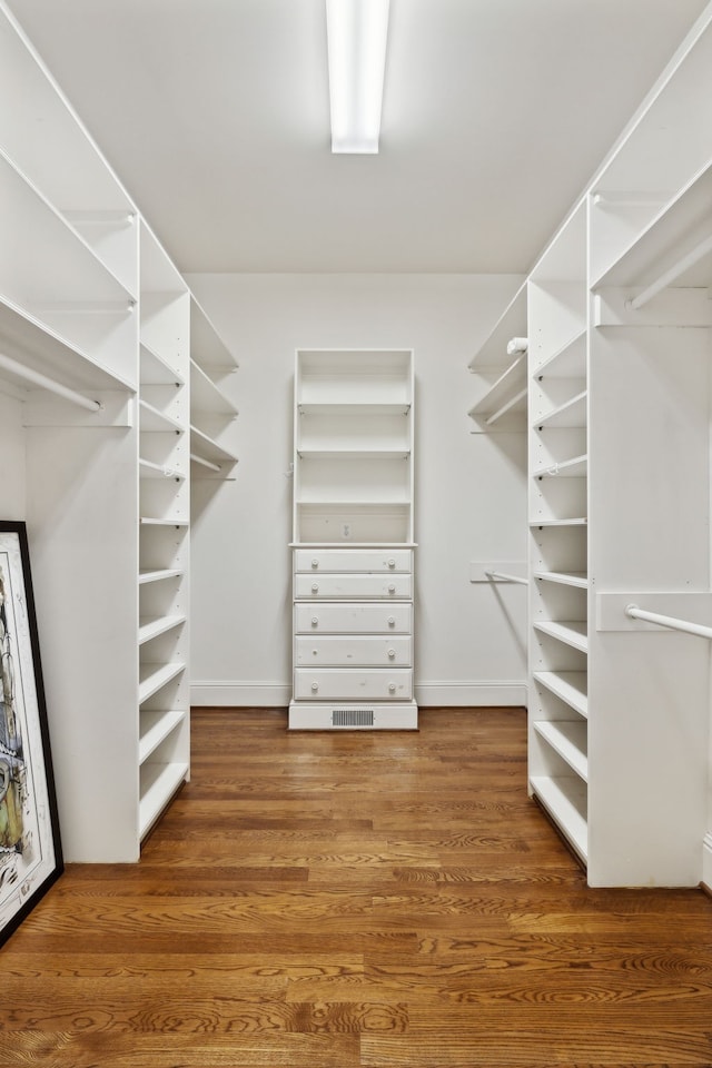 spacious closet featuring hardwood / wood-style floors