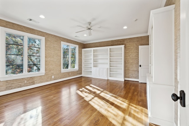 unfurnished bedroom with ceiling fan, crown molding, and dark hardwood / wood-style floors