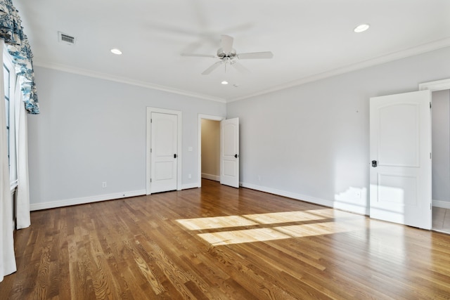 unfurnished bedroom featuring ceiling fan, ornamental molding, and hardwood / wood-style floors