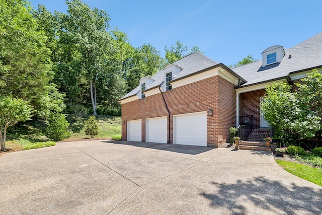 view of property exterior with a garage