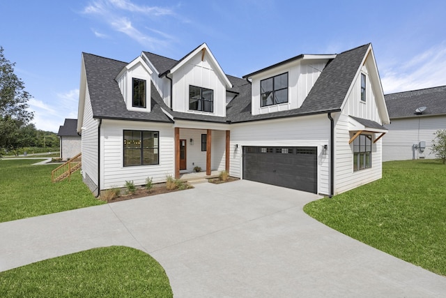 modern farmhouse featuring a garage and a front yard