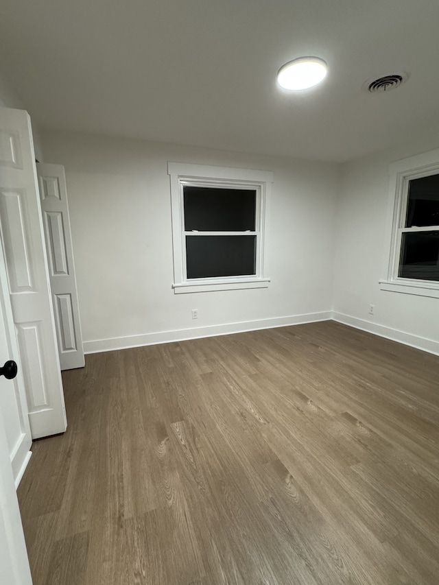 spare room featuring hardwood / wood-style flooring