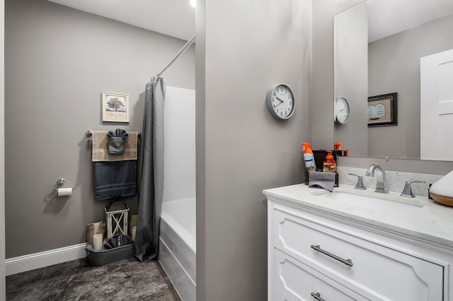 bathroom featuring shower / bath combo and vanity