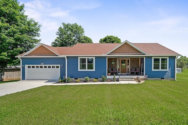 ranch-style home featuring a garage, a porch, and a front lawn