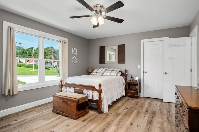 bedroom featuring light hardwood / wood-style floors and ceiling fan