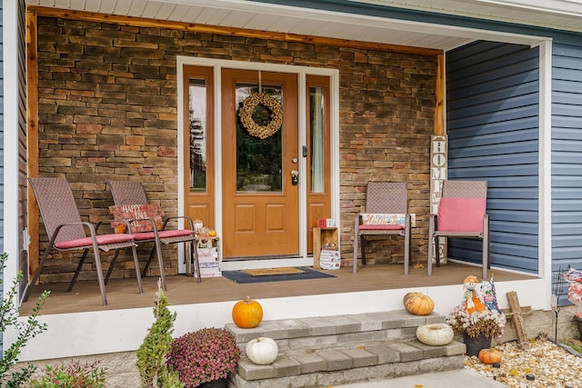 doorway to property with a porch