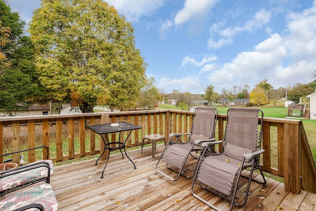 deck featuring a lawn