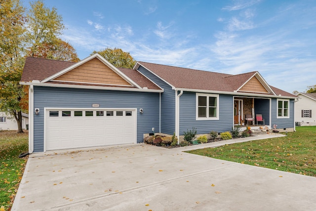 ranch-style house featuring a garage and a front lawn