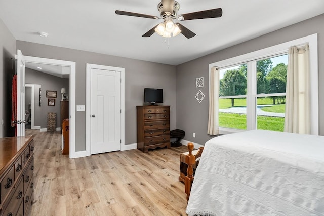 bedroom featuring light hardwood / wood-style floors and ceiling fan