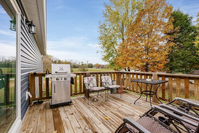 wooden terrace featuring area for grilling