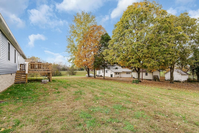 view of yard with a wooden deck