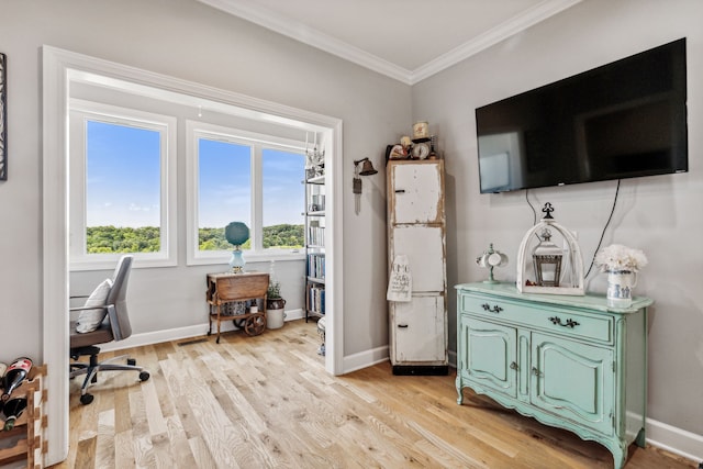 office area featuring ornamental molding and light hardwood / wood-style floors