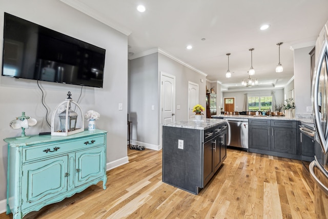 kitchen with light hardwood / wood-style floors, dishwasher, decorative light fixtures, and a kitchen island