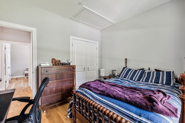 bedroom featuring light wood-type flooring and a closet