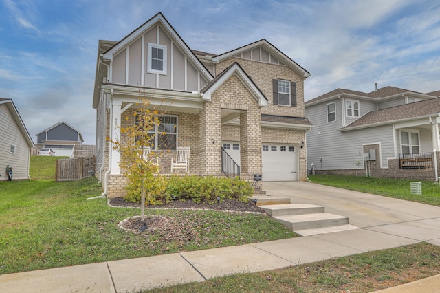 view of front facade featuring a garage, a porch, and a front yard