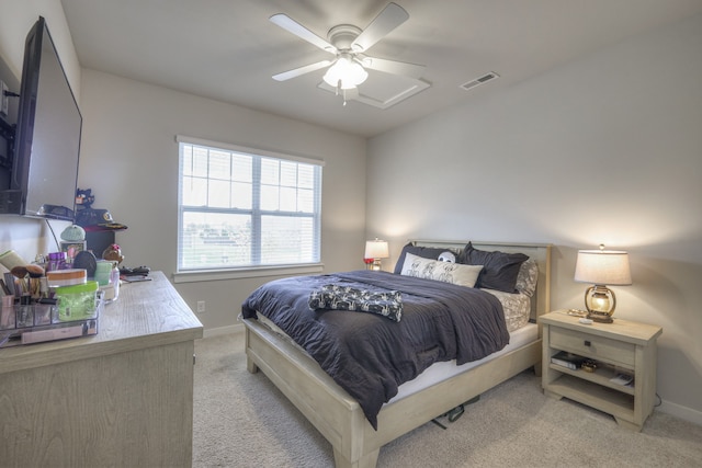 bedroom with light colored carpet and ceiling fan