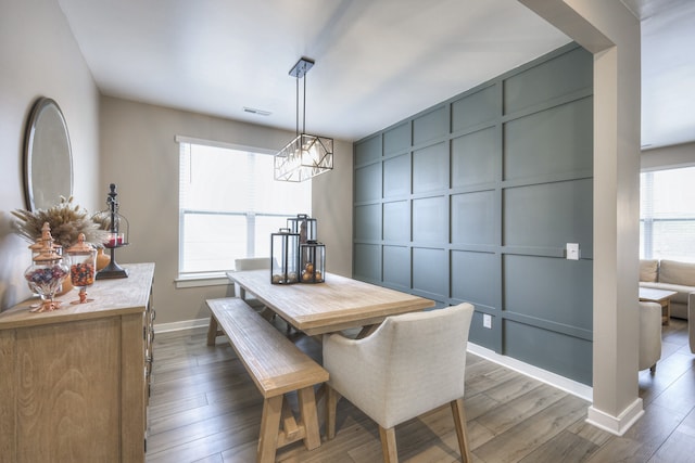 dining area featuring dark hardwood / wood-style floors