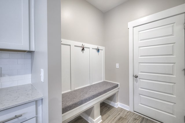 mudroom with light hardwood / wood-style flooring