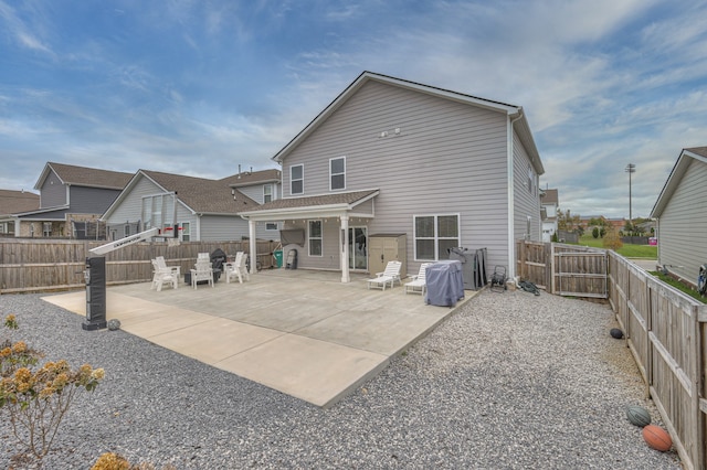 back of house with a patio