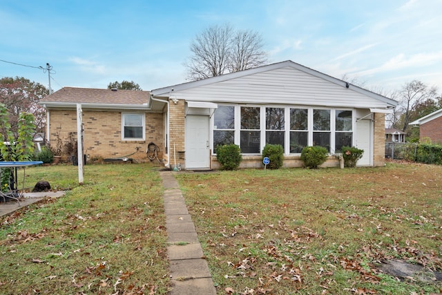 ranch-style home with a trampoline and a front yard