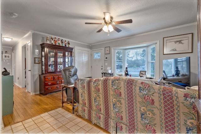 living room featuring hardwood / wood-style flooring, ceiling fan, and crown molding