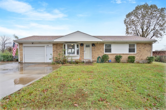 ranch-style home with a front lawn and a garage