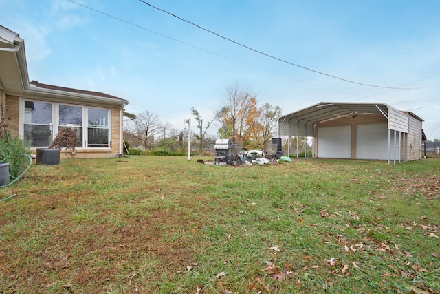 view of yard featuring an outdoor structure and a carport