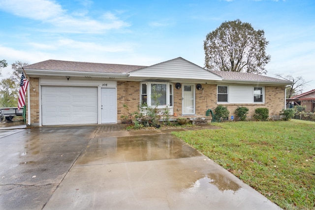 single story home featuring a garage and a front lawn