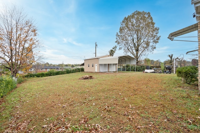 view of yard with a carport