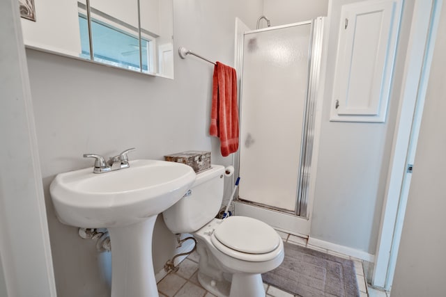 bathroom featuring tile patterned flooring and toilet