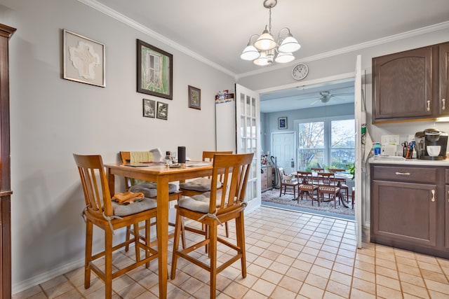 tiled dining room featuring crown molding and ceiling fan with notable chandelier