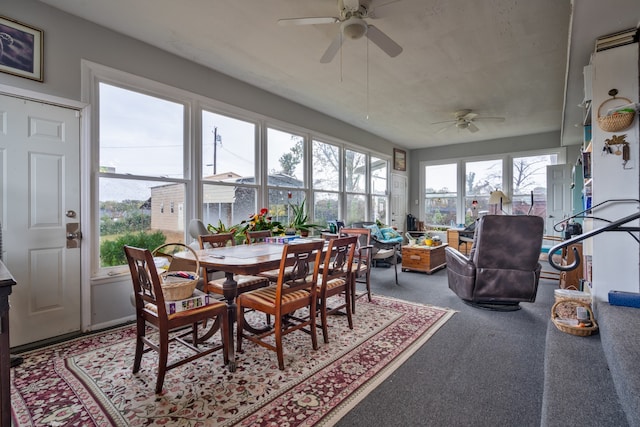 sunroom featuring ceiling fan