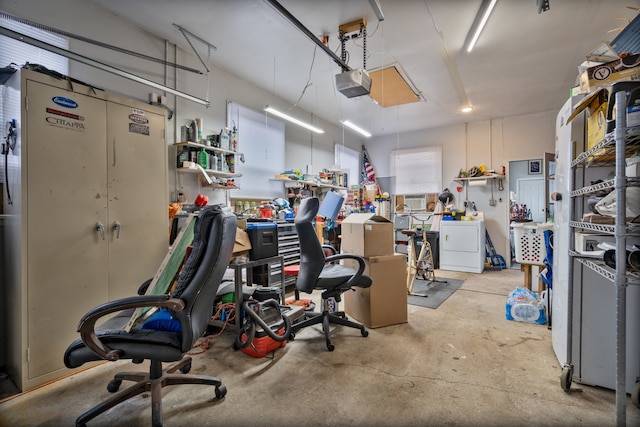 garage featuring a garage door opener and washer / clothes dryer