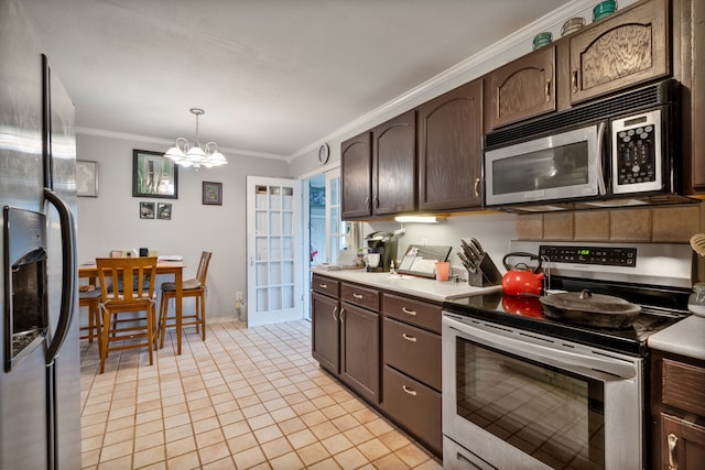 kitchen featuring stainless steel appliances, dark brown cabinetry, a notable chandelier, ornamental molding, and pendant lighting