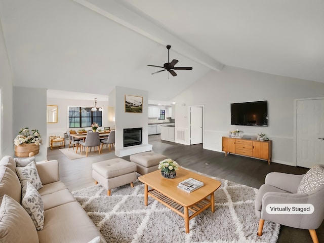 living room with high vaulted ceiling, dark hardwood / wood-style floors, ceiling fan, and beam ceiling