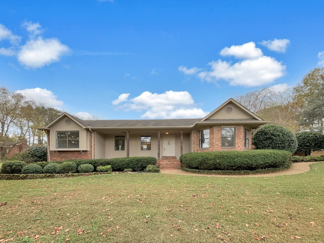 ranch-style home featuring a front yard